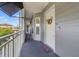 Outdoor hallway that leads to unit entrance with a white door at 650 Campus St # 309, Celebration, FL 34747