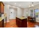 Open kitchen features an island, granite countertops, and adjacent breakfast area at 650 Campus St # 309, Celebration, FL 34747