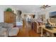 Open-concept living area with hardwood flooring, staircase, and stylish furnishings at 650 Campus St # 309, Celebration, FL 34747
