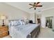 Comfortable primary bedroom with neutral tones, ceiling fan, and ample natural light at 650 Campus St # 309, Celebration, FL 34747