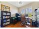 Home office with hardwood floors, shuttered windows, and a classic desk setup at 650 Campus St # 309, Celebration, FL 34747