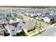 An aerial view shows homes with solar panels lining the streets of a community at 6514 Barnstorm Way, St Cloud, FL 34771