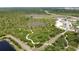 An aerial view shows the community trails through natural Florida landscape at 6514 Barnstorm Way, St Cloud, FL 34771