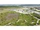 An aerial view of community trails and green space near a neighborhood at 6514 Barnstorm Way, St Cloud, FL 34771