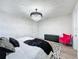 Bright bedroom featuring a modern chandelier, stylish furniture, and neutral decor at 6514 Barnstorm Way, St Cloud, FL 34771