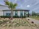 Charming single-story home showcases a lush, landscaped yard and inviting exterior, with a palm tree at 6514 Barnstorm Way, St Cloud, FL 34771