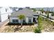 Inviting single-story home with manicured front yard, enhanced by a lovely palm tree and charming walkway at 6514 Barnstorm Way, St Cloud, FL 34771