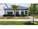 Inviting single-story home with well-manicured lawn, featuring a charming palm tree in the front yard at 6514 Barnstorm Way, St Cloud, FL 34771