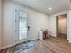 Bright entry foyer with stylish front door, elegant console table and wood-look flooring at 6514 Barnstorm Way, St Cloud, FL 34771