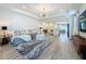 Spacious living room with modern decor, featuring a gray sectional sofa and open-concept design at 6514 Barnstorm Way, St Cloud, FL 34771
