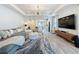 Bright, open living room with modern furnishings, stylish lighting, and a spacious layout at 6514 Barnstorm Way, St Cloud, FL 34771