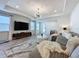 Bright living room featuring recessed lighting, wood floors, and a comfortable sectional sofa with decorative pillows at 6514 Barnstorm Way, St Cloud, FL 34771