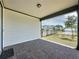Covered patio area with brick flooring, perfect for outdoor seating and entertaining at 6514 Barnstorm Way, St Cloud, FL 34771