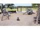 Charming playground featuring swings, a slide, and various seating options for a fun-filled experience at 6514 Barnstorm Way, St Cloud, FL 34771