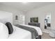 Comfortable bedroom featuring a comfortable queen bed and neutral decor at 7211 Oakmoss Loop, Davenport, FL 33837