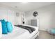 Comfortable bedroom with queen-size bed, soft blue pillows, and sliding closet doors at 7211 Oakmoss Loop, Davenport, FL 33837