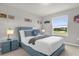 Stylized bedroom featuring a comfortable bed, themed decor, and lots of natural light at 7211 Oakmoss Loop, Davenport, FL 33837