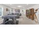 Spacious game room featuring a large sectional couch, foosball table, and a large flat screen television at 7211 Oakmoss Loop, Davenport, FL 33837