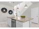Bright kitchen featuring stainless steel appliances, large island with granite countertops, and pendant lighting at 7211 Oakmoss Loop, Davenport, FL 33837