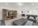 Spacious living room with comfortable seating, entertainment center, foosball table, and stylish decor at 7211 Oakmoss Loop, Davenport, FL 33837