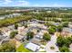 Vast aerial shot of a residential area near several ponds, surrounded by mature trees and well-maintained single Gathering homes at 829 Clear Creek Cir, Clermont, FL 34714