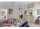 Bedroom featuring a large bed, dresser with a TV, and decor at 829 Clear Creek Cir, Clermont, FL 34714