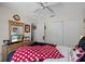 Bedroom featuring a dresser, bed, closet, and ceiling fan at 829 Clear Creek Cir, Clermont, FL 34714