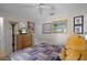 Comfortable bedroom with a ceiling fan, soft color palette and fun Winnie the Pooh themed decor creating a pleasant atmosphere at 829 Clear Creek Cir, Clermont, FL 34714