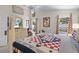 Bedroom featuring a large bed, dresser with a TV, and decor at 829 Clear Creek Cir, Clermont, FL 34714
