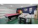 Large game room equipped with a pool table, air hockey table, and playful decor, perfect for entertaining at 829 Clear Creek Cir, Clermont, FL 34714
