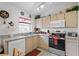 Efficient kitchen layout features modern appliances, ample storage, and a bright atmosphere, perfect for culinary creations at 829 Clear Creek Cir, Clermont, FL 34714