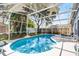 Picturesque screened-in pool offering a refreshing escape with its clear blue water and inviting surroundings at 829 Clear Creek Cir, Clermont, FL 34714