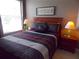 Comfortable bedroom with a full-sized bed and night stands at 8809 Dunes Ct # 201, Kissimmee, FL 34747