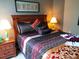 Well decorated bedroom with warm lamps and two night stands at 8809 Dunes Ct # 201, Kissimmee, FL 34747