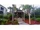 Charming community gazebo with seating area, surrounded by lush landscaping at 8809 Dunes Ct # 201, Kissimmee, FL 34747