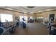 Bright and spacious gym featuring treadmills, ellipticals, and weight machines for resident fitness at 8809 Dunes Ct # 201, Kissimmee, FL 34747