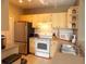 Bright kitchen featuring stainless steel appliances and a double sink at 8809 Dunes Ct # 201, Kissimmee, FL 34747