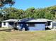 A charming single-Gathering home featuring a well-maintained lawn and inviting curb appeal at 905 W 11Th Ave, Mount Dora, FL 32757