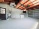 Spacious garage featuring ample storage space and a clean, organized layout at 905 W 11Th Ave, Mount Dora, FL 32757