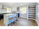 Well-designed kitchen featuring an island with seating, stainless appliances, and hardwood floors at 905 W 11Th Ave, Mount Dora, FL 32757