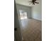 Bedroom with tiled floor and sliding glass door at 352 Madina Cir, Davenport, FL 33837