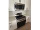 Modern kitchen features stainless steel appliances and white cabinets at 352 Madina Cir, Davenport, FL 33837