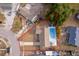 Aerial view of the property, noting pool, spacious yard, neighboring houses, and street access at 1007 Maya Ave, Orlando, FL 32822