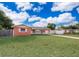 Beautifully maintained home with an attached garage and a spacious front yard at 1007 Maya Ave, Orlando, FL 32822