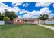 Charming one-story home featuring a lush green lawn and a well-maintained exterior at 1007 Maya Ave, Orlando, FL 32822