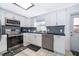 Well-equipped kitchen featuring stainless steel appliances, modern cabinetry, and tiled flooring at 1007 Maya Ave, Orlando, FL 32822