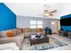 Bright and open living room showcasing a sectional sofa, tile floors, and neutral wall colors at 1007 Maya Ave, Orlando, FL 32822