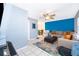 Cozy living room with tile flooring, a ceiling fan, and comfortable seating arrangements at 1007 Maya Ave, Orlando, FL 32822