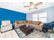 Comfortable living room featuring tile floors, a neutral-toned sectional, and modern decor at 1007 Maya Ave, Orlando, FL 32822