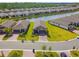 An aerial shot features homes in a planned community, showing manicured lawns and cohesive architecture at 1014 Umbria Dr, Kissimmee, FL 34759